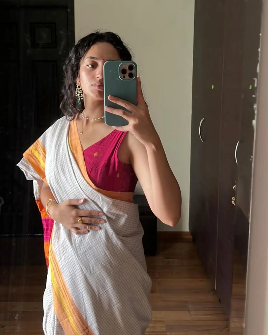 Malvika Nair in White Saree Sleeveless Red Blouse